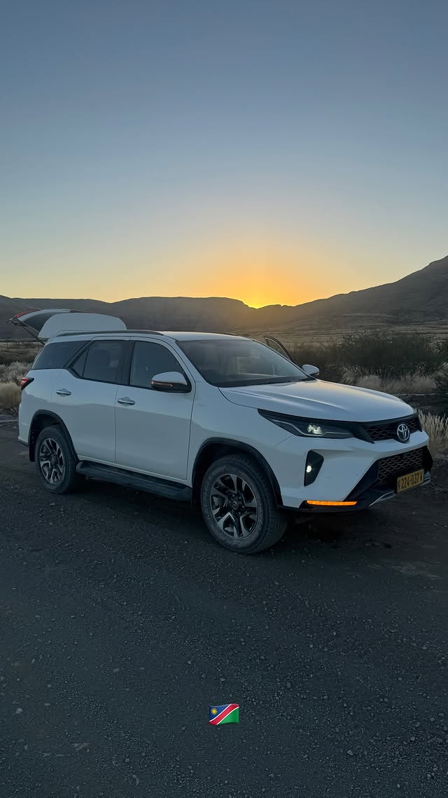 Toyota Fortuner on a Namibian gravel road at sunset — New Trend Car Rental & Tours